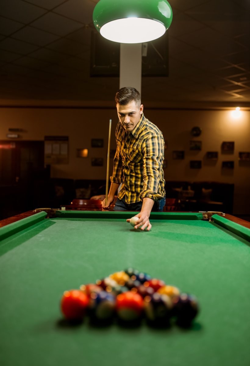 male-billiard-player-with-cue-aiming-at-the-table.jpg male-billiard-player-with-cue-aiming-at-the-table.jpg